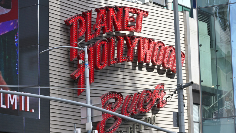 Planet Hollywood logo on a building wall in Manhattan.