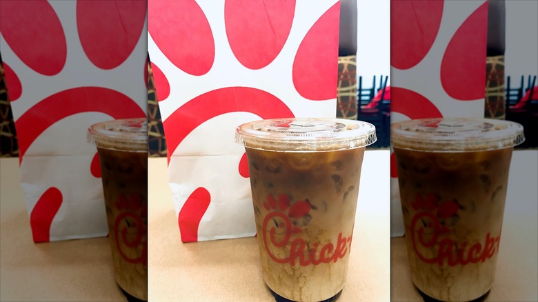 A cup of Chick-fil-A iced coffee in front of a bag