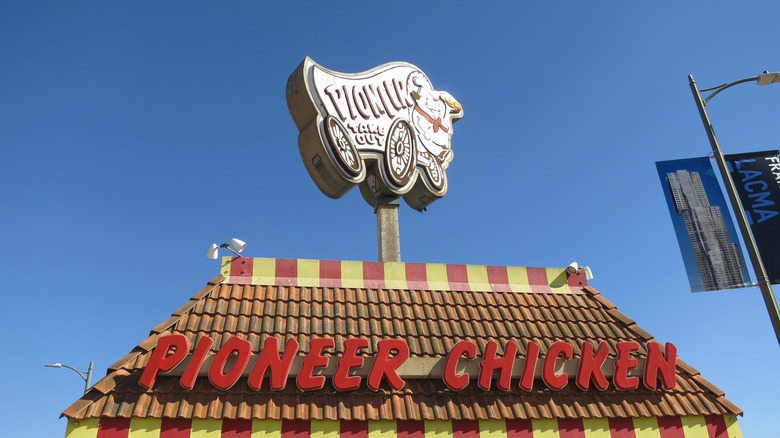 The roof of a Pioneer Chicken franchise with its iconic sign on top