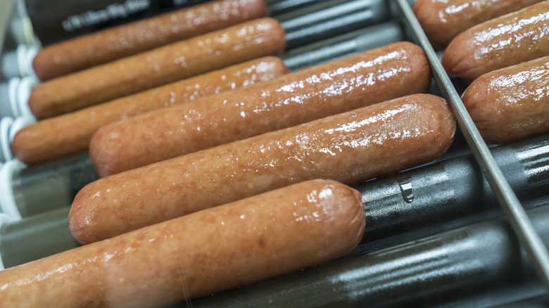 Big Bite hot dogs spinning on a 7-Eleven roller grill