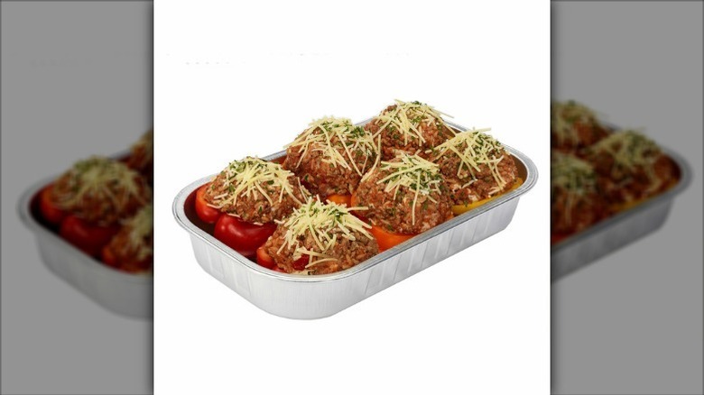 Package of stuffed bell peppers on white background