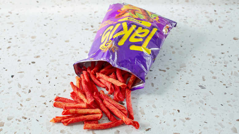 Takis spilling out of a bag