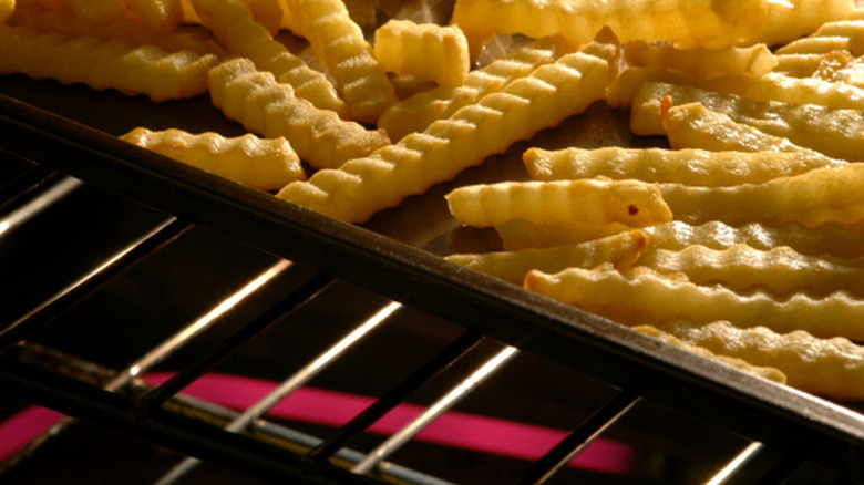 Crinkle cut fries on sheet pan in oven