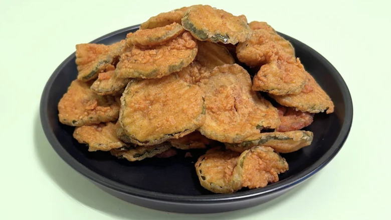 Texas Roadhouse fried pickles against light green background