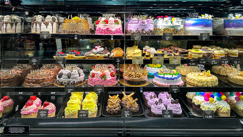 Various decorated cakes at a grocery store bakery