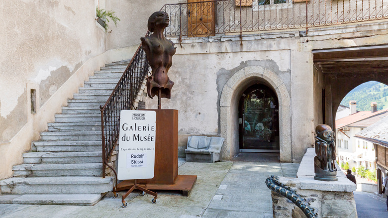exterior of Giger museum with alien statues