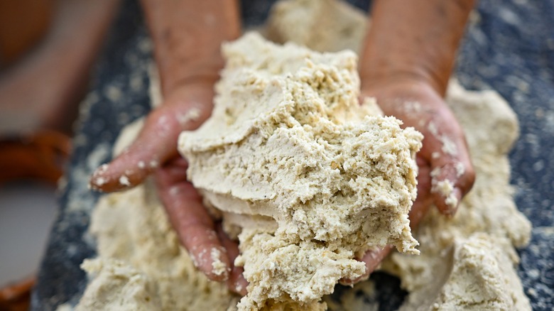 Mixing tortilla dough by hand