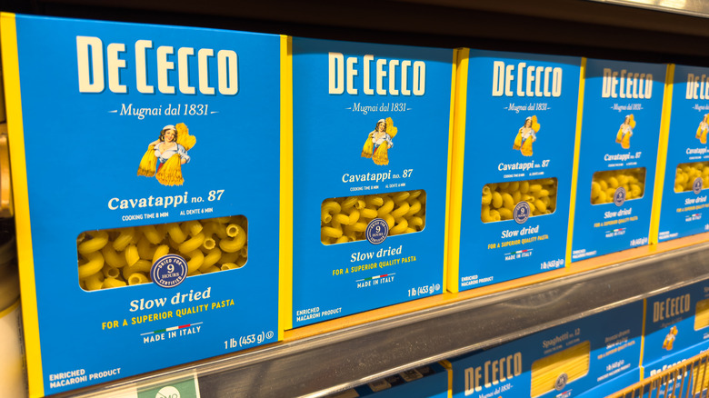 Boxes of De Cecco cavatappi pasta on a grocery store shelf