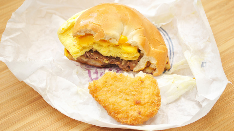 McDonald's steak, egg, and cheese bagel sandwich with hash brown in wrapper