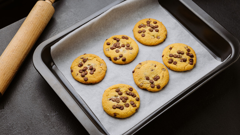 Cookies on baking sheet with rolling pin