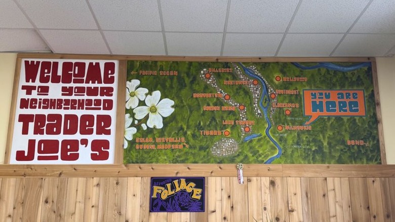 A sign that says "Welcome to your neighborhood Trader Joe's" with an illustrated regional map
