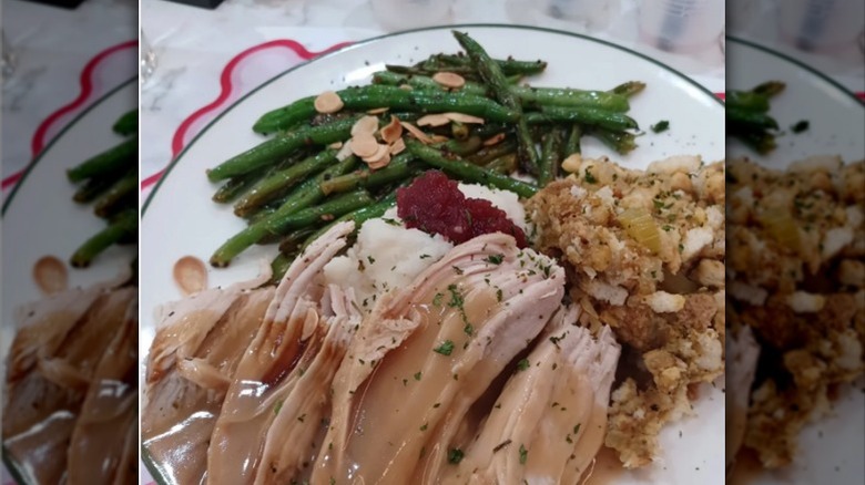 Perkins plate of turkey, stuffing, mashed potatoes, green beans, and cranberry sauce