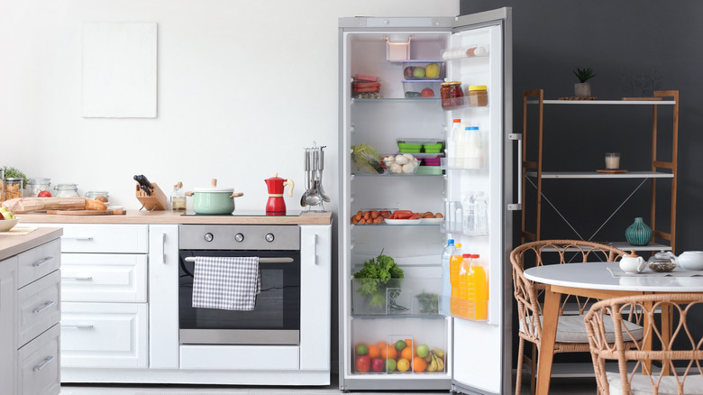 Open fridge in a neat kitchen
