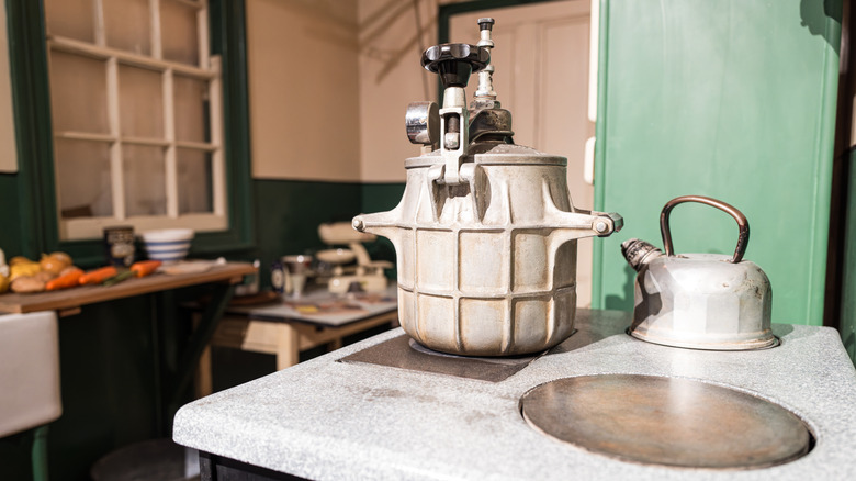 Old fashioned kitchen with pressure cooker and hot plate