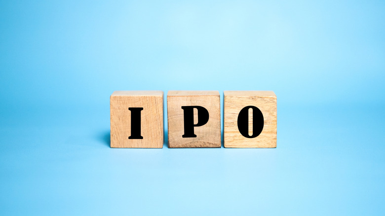 The letters IPO spelled out with wooden blocks