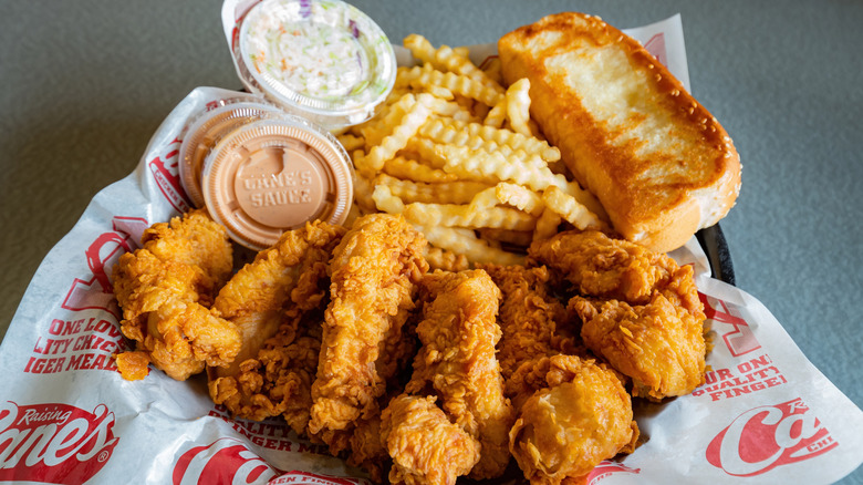 Basket of chicken fingers, fries and sauce from Raising Cane's