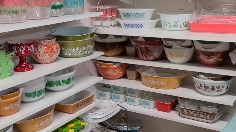 A large collection of vintage Pyrex on shelves