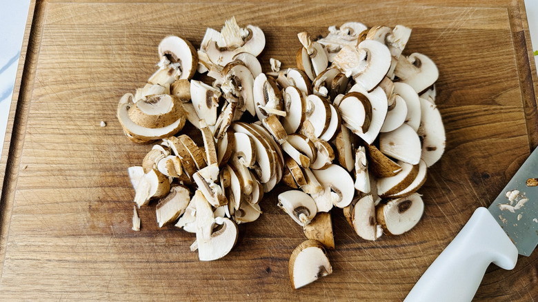 chopped mushrooms on a wooden board