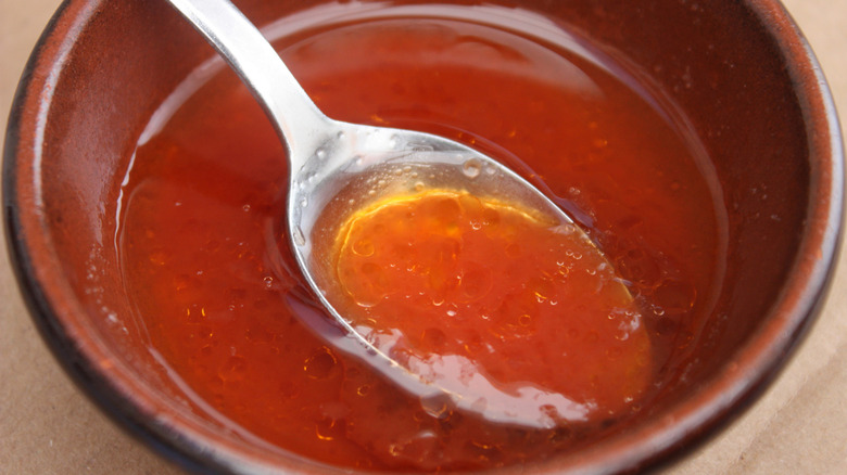 French salad dressing in a bowl with a spoon