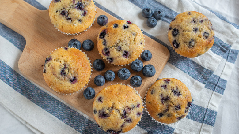 Blueberry muffins on cutting board