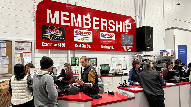 Costco membership desk with customers all around it