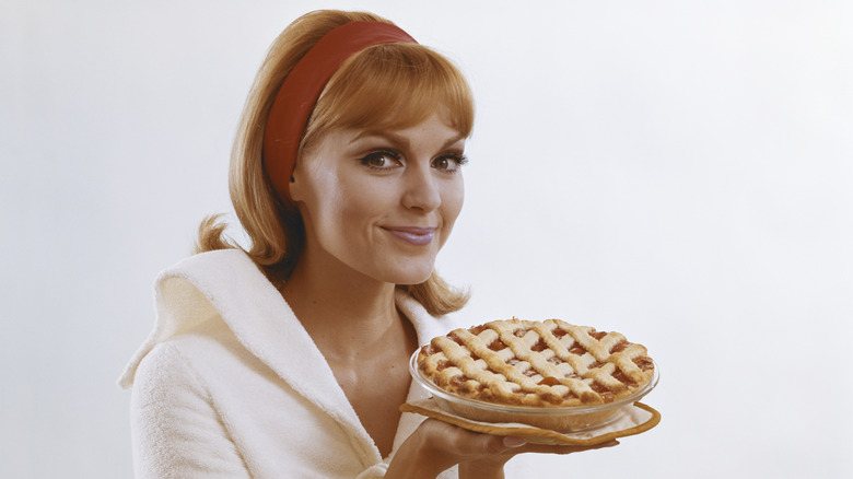 1960s woman holding a pie