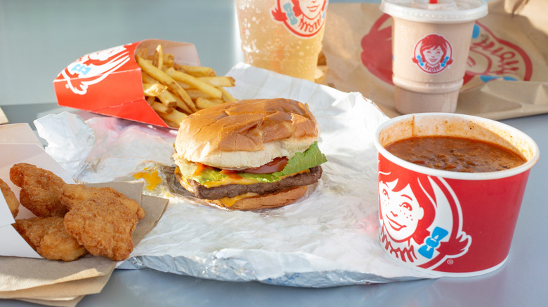 Selection of Wendy's menu items arranged on gray surface.