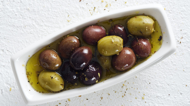 Dish of olives in oil