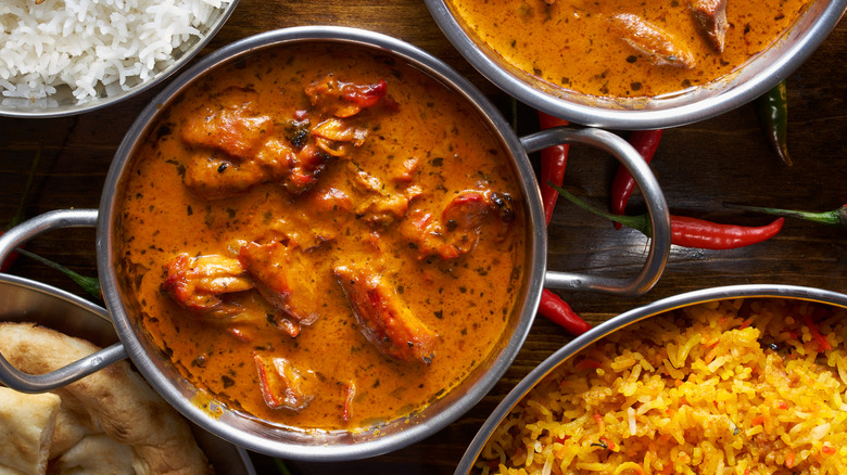 Pans with curry and rice