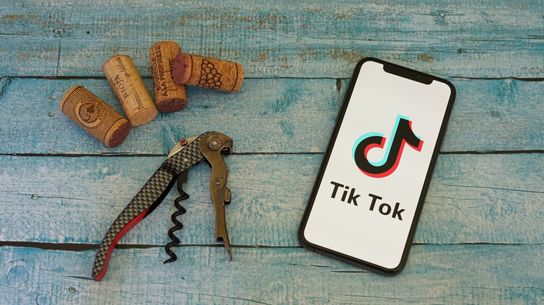 tiktok app, corkscrew, and corks