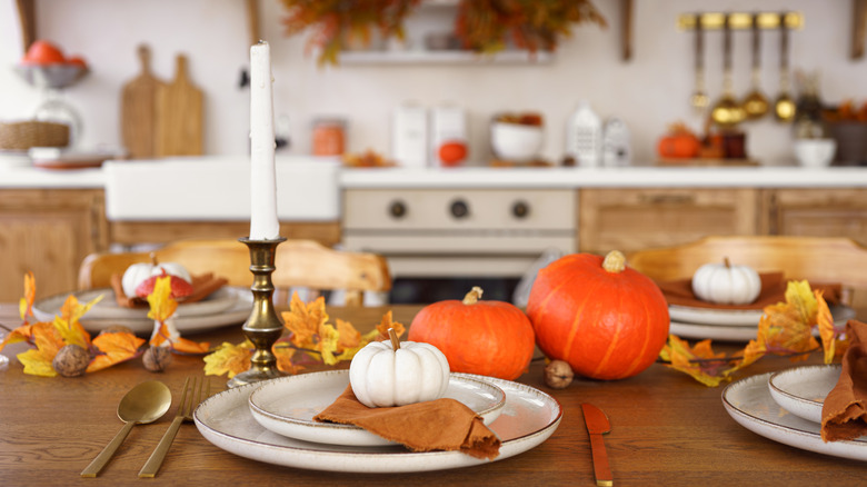 A kitchen and tablescape with a fall vibe