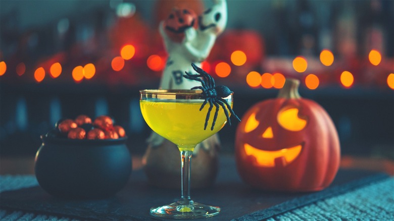 Green Halloween drink with festive decor 