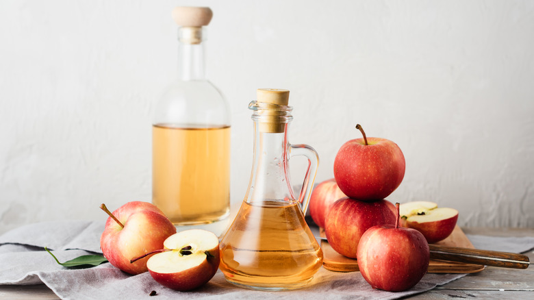 Apple cider vinegar with apples