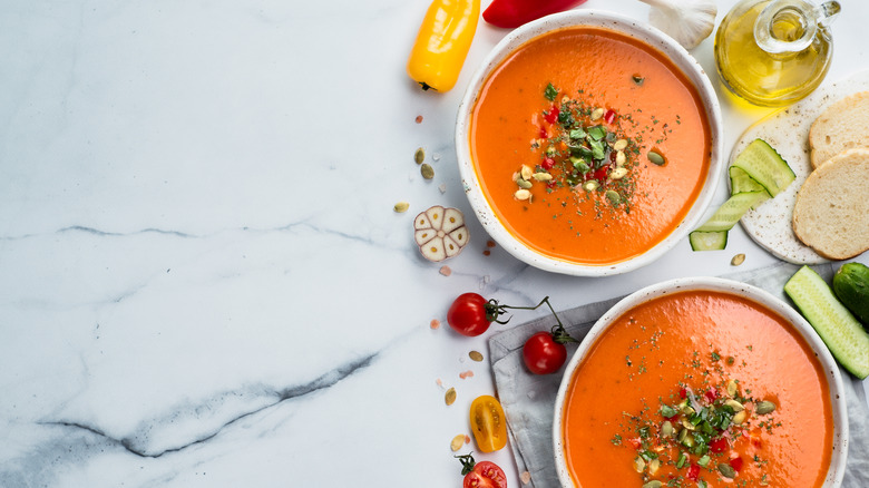 two bowls with tomato soup purée