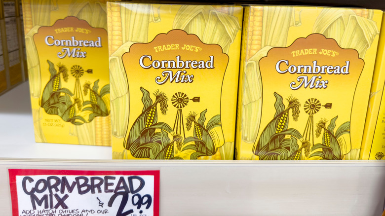 A shelf at Trader Joe's with boxes of Cornbread Mix