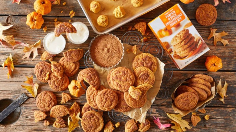 A fall table landscape with Trader Joe's Pumpkin & Spice Snickerdoodle Cookie Mix at the center