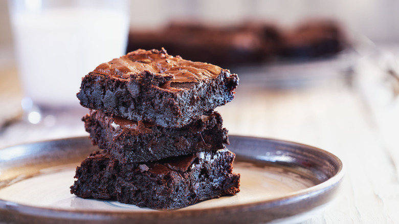 Brownies stacked with milk