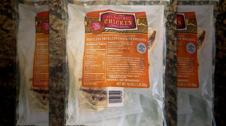 Trader Joe's boneless skinless fully cooked chicken breasts in bag on countertop