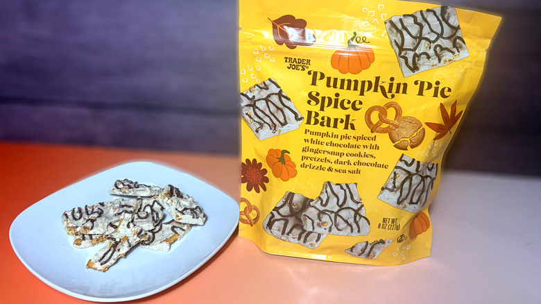 trader joes pumpkin spice bark pieces on plate next to product package