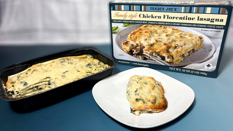 cooked trader joes chicken florentine lasagna in pan and on plate in front of product box