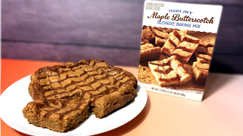 prepared trader joes maple butterscotch blondies on plate in front of product box