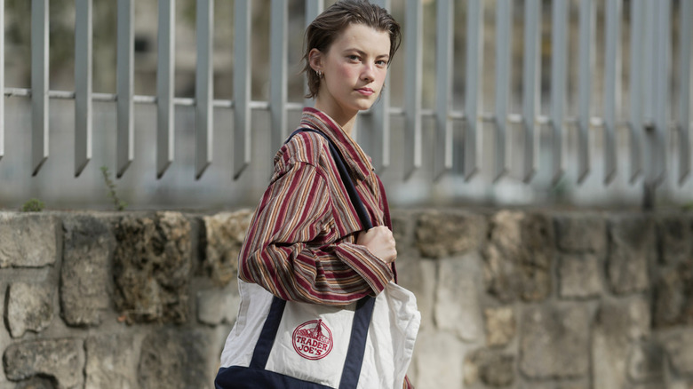 Model at Paris Fashion Wekk holding a TJ's tote