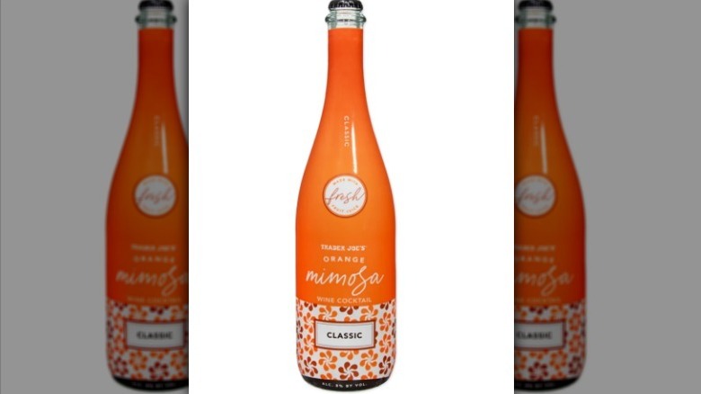 Orange mimosa wine cocktail on white background