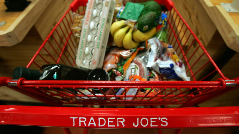 Red Trader Joe's shopping cart filled with groceries