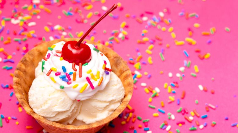 Ice cream with rainbow sprinkles and a cherry on top