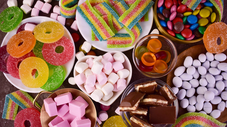 Overview of various types of candy in bowls