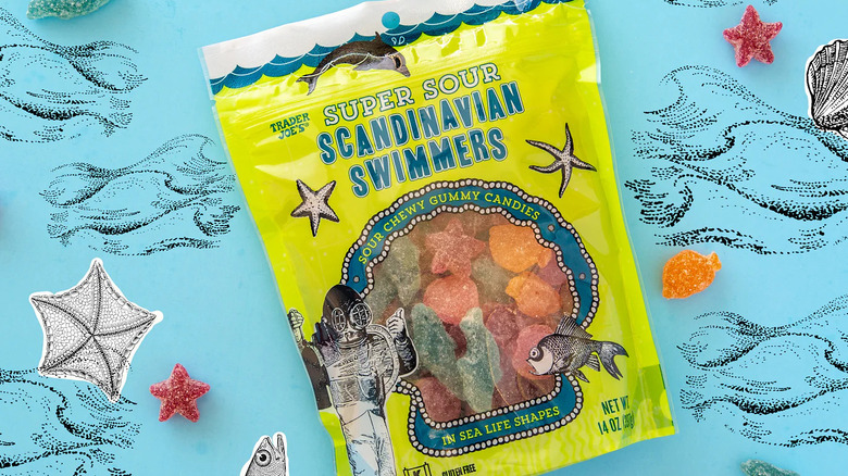 Sour swimmer candy on blue surface