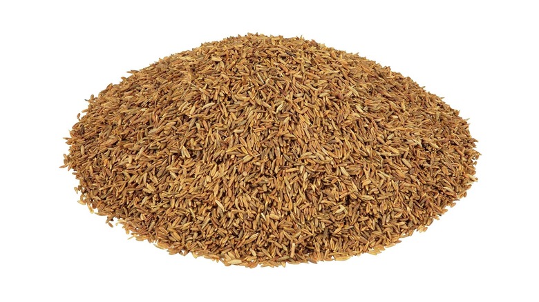 Pile of whole cumin seeds