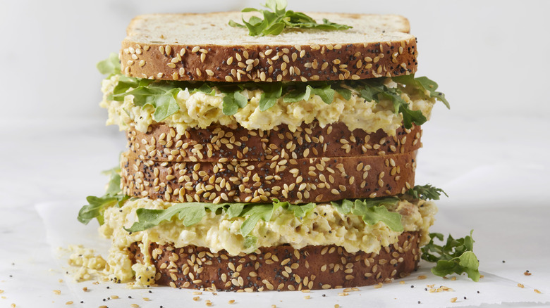 egg salad sandwich with arugula
