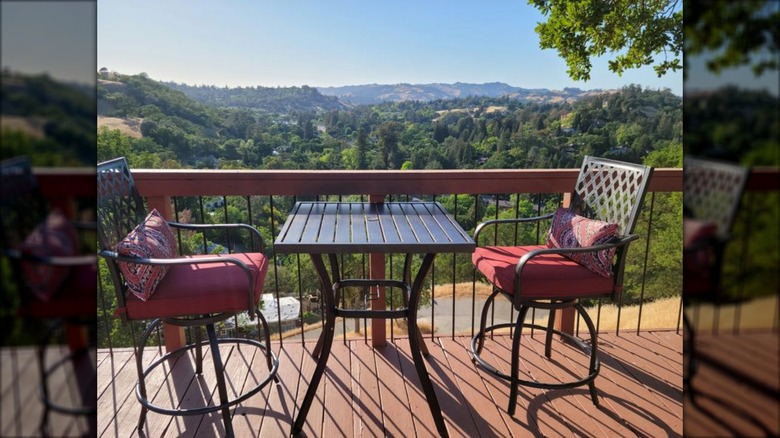 Phi Villa 6-piece metal bar-height set with red cushions and umbrella